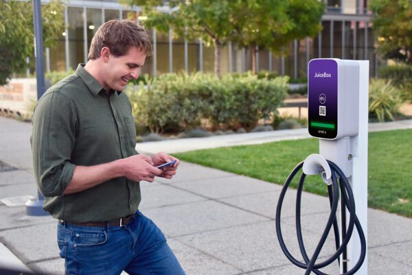 Man Happy to be Using Juice Box EV Charger
